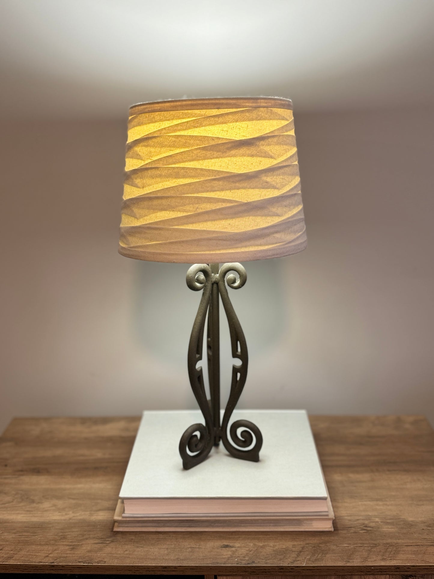 Wrought iron lamp with gathered linen shade