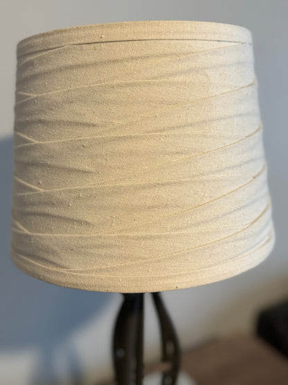 Wrought iron lamp with gathered linen shade