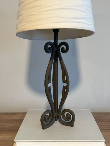 Wrought iron lamp with gathered linen shade
