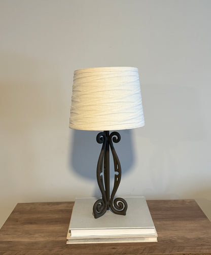Wrought iron lamp with gathered linen shade