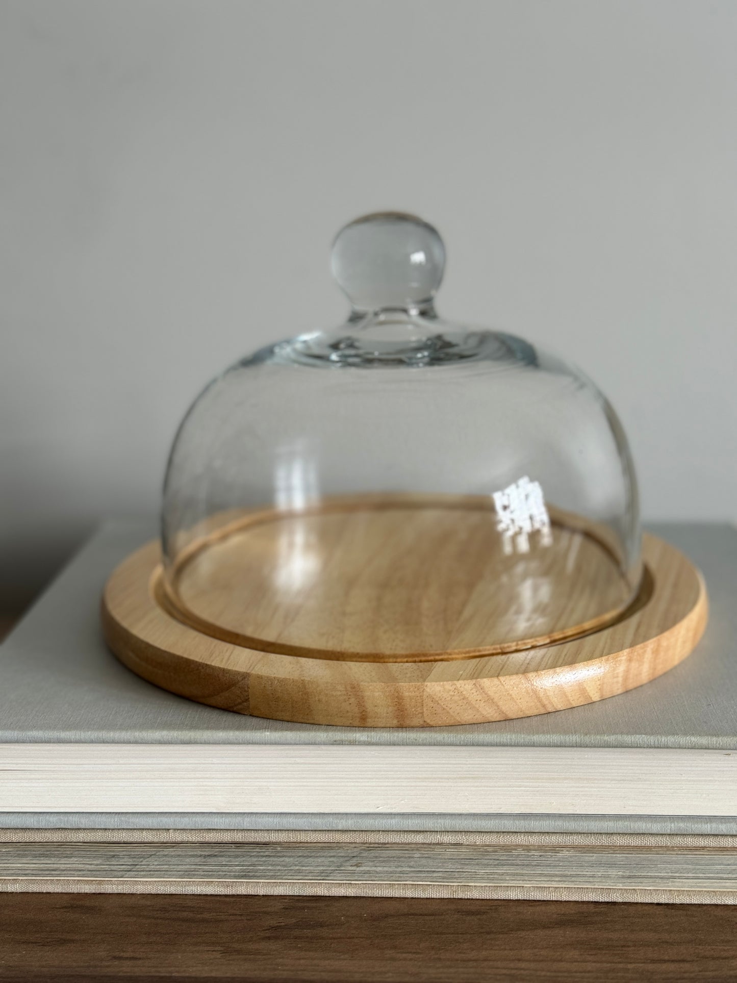 Glass cloche with wood base